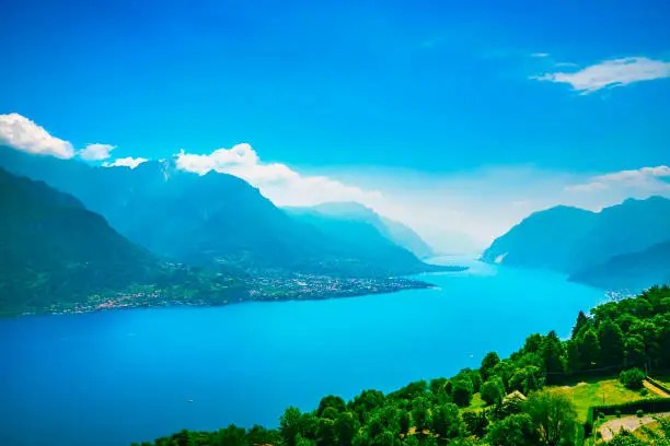Photo of Como Lake landscape. Lake, alps and village view, Italy