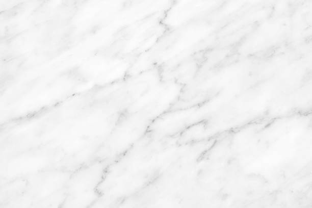 istock White Carrara Marble natural light surface for bathroom or kitchen countertop 1077978834
