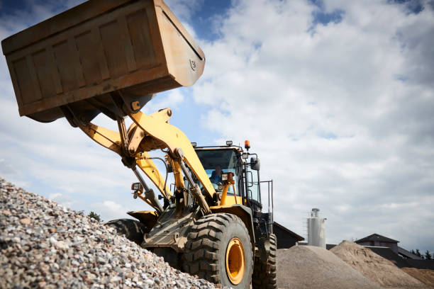 istock Excavator moving sand in a gravel pit 1077978880