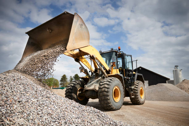istock Excavator moving sand in a gravel pit 1077979004