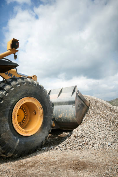 istock Excavator moving sand in a gravel pit 1077979060