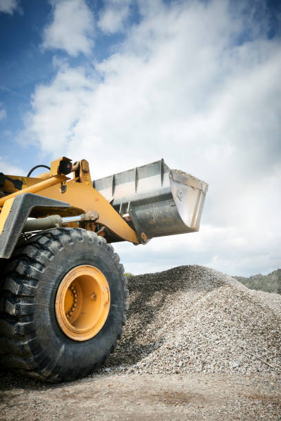 istock Excavator moving sand in a gravel pit 1077980804