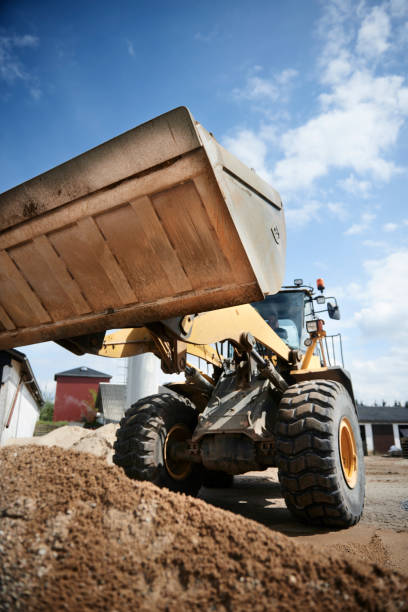 istock Excavator moving sand in a gravel pit 1077980878