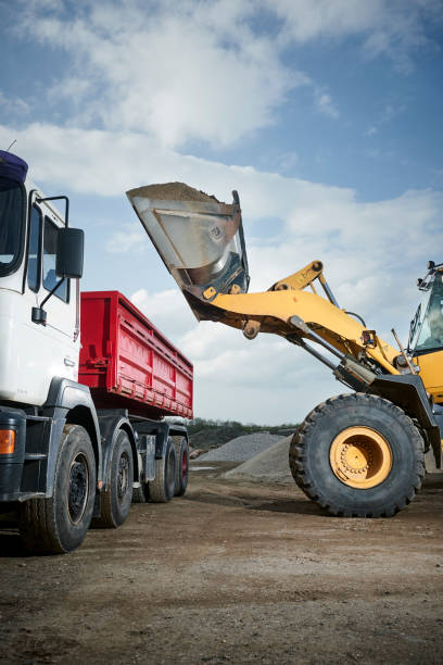 istock Excavator moving sand in a gravel pit 1077980966