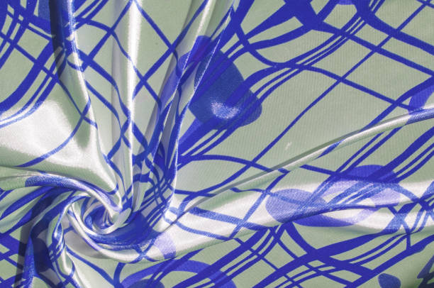 istock Silk. The fabric is white in steel, the fabric is colored with blue lines. Fix it with this exciting patchwork ! This material is slightly transparent, pleasantly soft and contains an elegant drapery. 1077981004