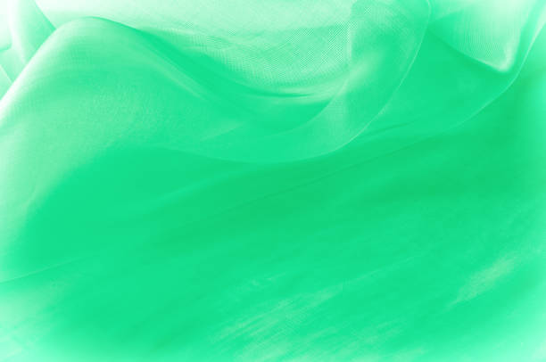 istock Texture, background, pattern. Green silk fabric for draping. Abstract Fabric, Artistic Waving Cloth Fractal Pattern 1077981076