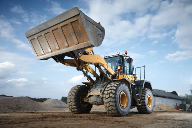 istock Excavator moving sand in a gravel pit 1077981148
