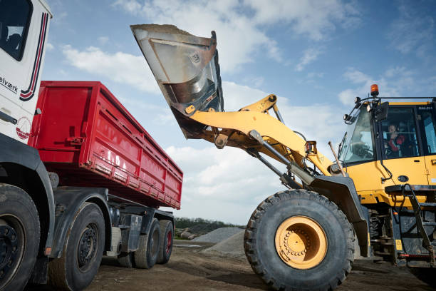 istock Excavator moving sand in a gravel pit 1077981224