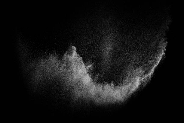 istock Freeze motion of white particles on black background. 1077981270