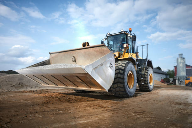 istock Excavator moving sand in a gravel pit 1077984816
