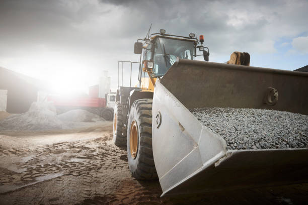 istock Excavator moving sand in a gravel pit 1077984880