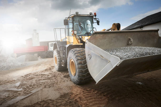 istock Excavator moving sand in a gravel pit 1077984944