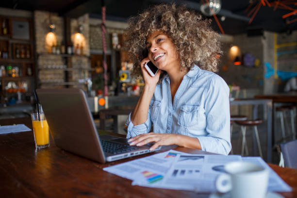 istock Focused young African woman working online in a cafe 1077985016