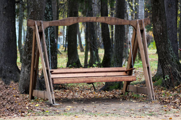 istock Large wooden swing in the forest 1077985860