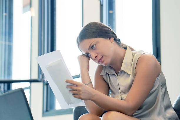 istock Young woman got a bad letter uvolnenii 1077987978