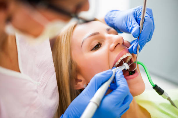 istock Young woman at dentist 1077991568