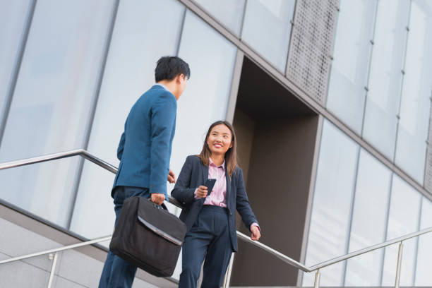 istock Business people discussing on stairs 1077996394