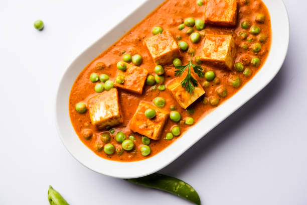 istock Green peas or matar paneer curry recipe, served in a bowl. selective focus 1077999444