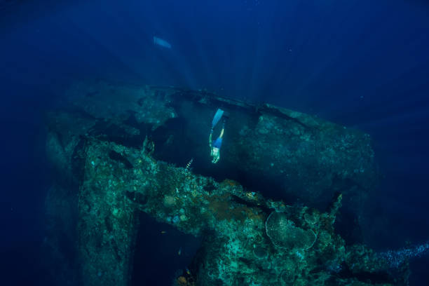 istock Freediver man dive at shipwreck, underwater 1077999698