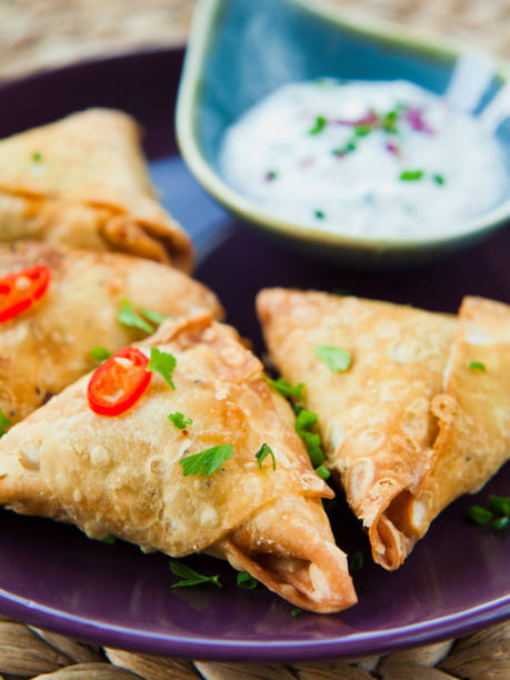 istock Indian Spicy Vegetable samosa with Mint Yoghurt Raita. 1078001478