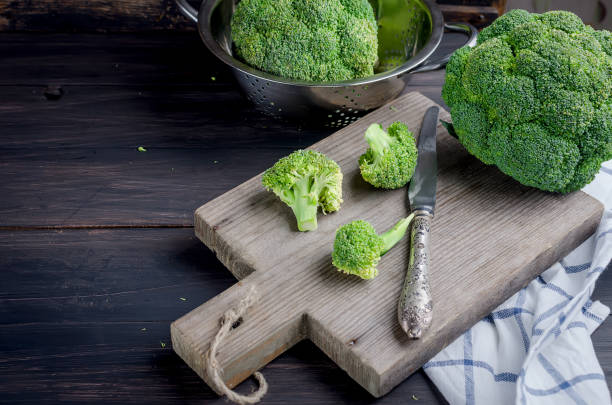 istock Pieces of broccoli, rustic style, old wooden background 1078006862
