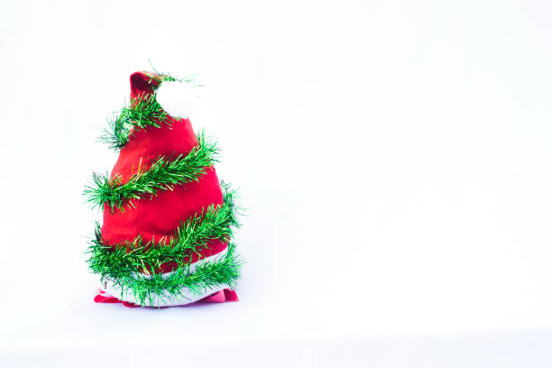 istock Christmas background with red hat, colorful ribbon tree decoration 1078008608