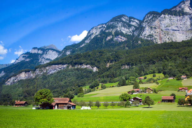 istock Dolomites Apls, blue sky and green lawn. 1078009598