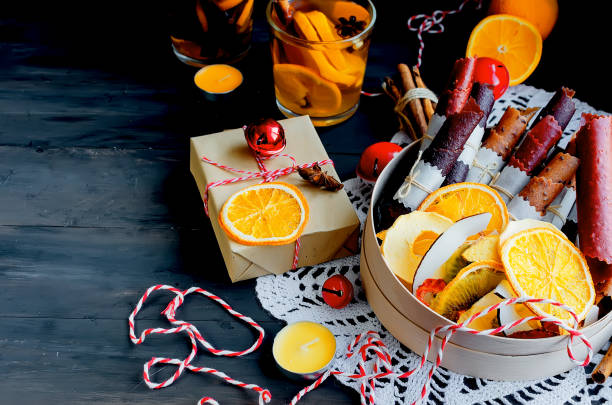 istock warming winter tea, dry fruits on xmas day 1078009728