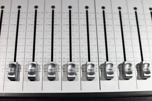 silver-plated brushed steel sound mixer with different sliding levers for adjusting effects and volumes