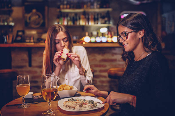 istock Women eating in restaurant 1078012132