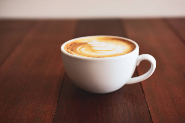istock Latte art coffee on wooden table on coffee time 1078012372