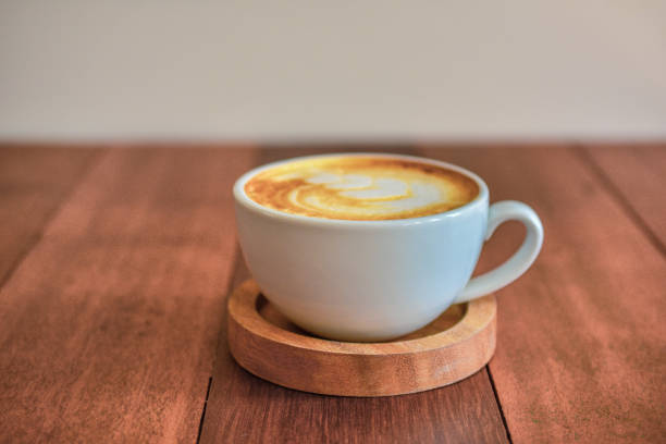istock Latte art coffee on wooden table on coffee time 1078012728