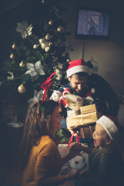 istock Christmas surrounded by family. 1078012730
