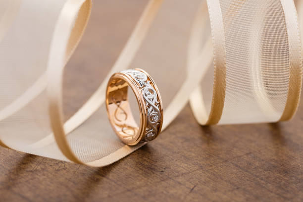istock Original pink gold and white gold bridal ring with floral ornament pattern 1078014492