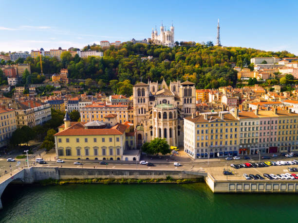 View from drone of Cathedral, Basilica and Saone, Lyon View from drone of Cathedral of Saint-Jean and Notre Dame Basilica on Fourviere hill on bank of river Saone in Lyon, France lyon photos stock pictures, royalty-free photos & images