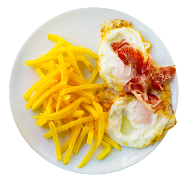 istock Top view of fried eggs with potatoes, and ham 1078014786