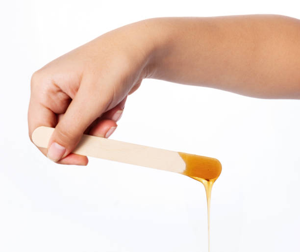 istock Honey wax on a spatula - Isolated 1078015424