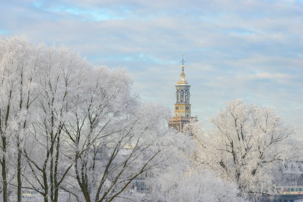 istock Frozen trees with the Nieuwe Toren (New Tower) in Kampen 1078017708