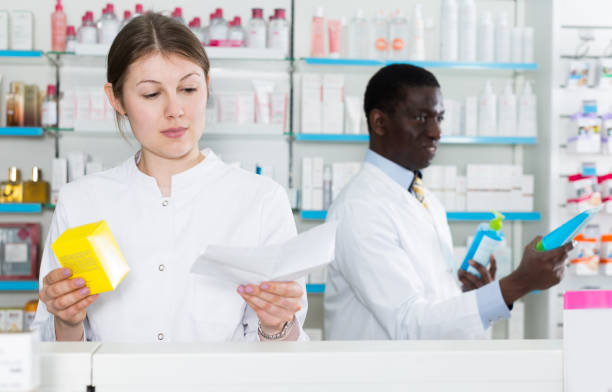 istock female druggist picking up prescription medicines 1078018802