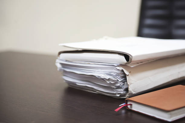 istock Pile of unfinished documents on office desk, Stack of business paper. 1078021044