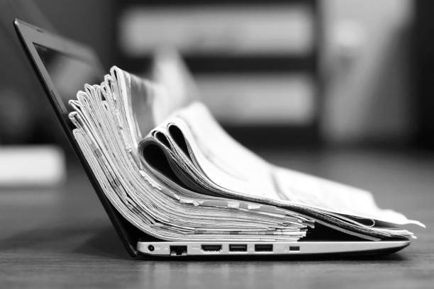 istock Newspapers and laptop 1078023214