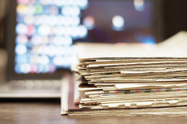 istock Newspapers and laptop 1078024050