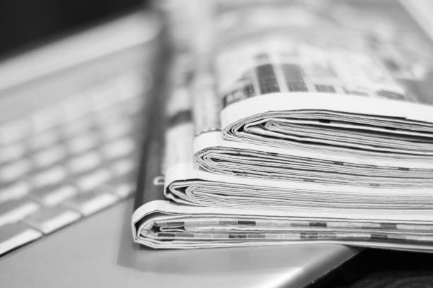 istock Newspapers and laptop 1078024470