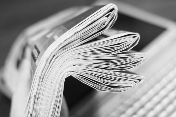 istock Newspapers and laptop 1078024522