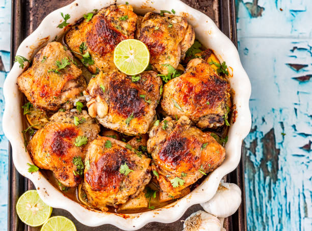 baked chicken thighs - close up roasted meal pepper imagens e fotografias de stock