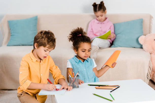 istock adorable multiethnic kids drawing and studying together 1078027634