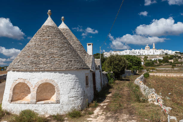 Attractions of The City of Puglia 29.09.2018 Locorotondo , Italy Apulia region tourist attractions n/z Trulli buildings city view photo: P.Dziurman/REPORTER trulli house photos stock pictures, royalty-free photos & images