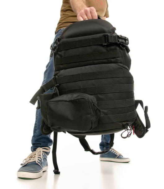 istock Man legs feet jeans sneakers with backpack 1078031702