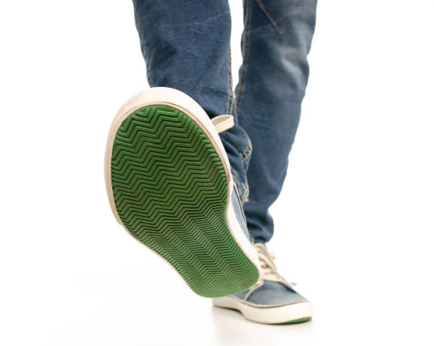 istock Man legs feet jeans sneakers 1078031738