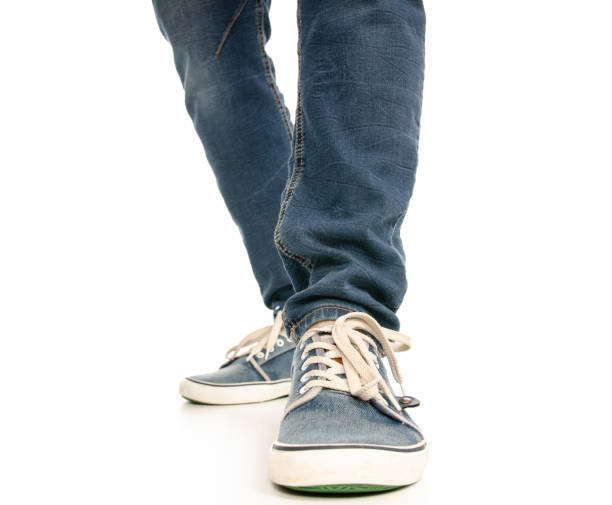 istock Man legs feet jeans sneakers 1078031774